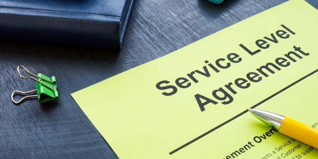 Note pad on a desk outlining a service level agreement.